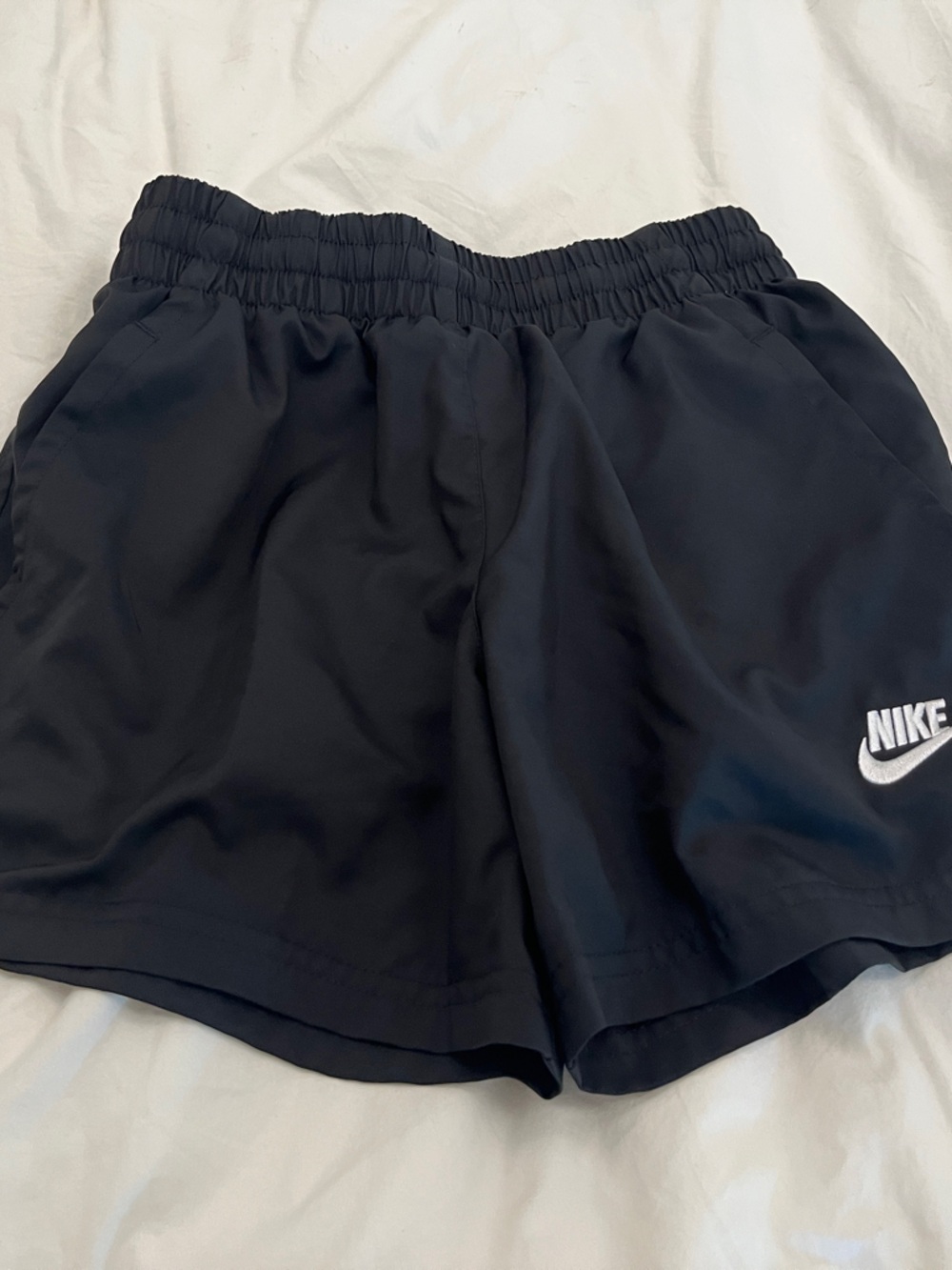 Nike kids Black Athletic Shorts with White Swoosh
